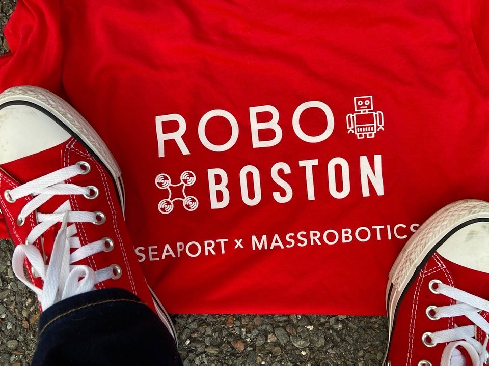 Robo Boston 2023 Seaport X MassRobotics (image of red sneakers with the event logo below)