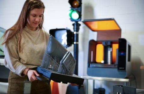 a young woman in a manufacturing setting