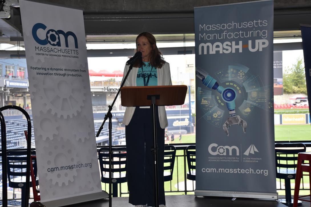 Christine Nolan at podium from Mash-Up